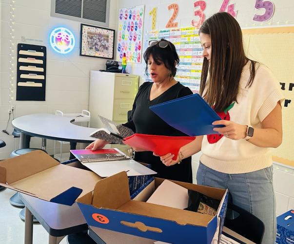 Makayla England (left) and Felicia Cain, third-grade teachers at Oglethorpe County Elementary School, prepare for the first day of school, which is Friday. Teachers went back to work on Monday. (Becky Soto/The Oglethorpe Echo)
