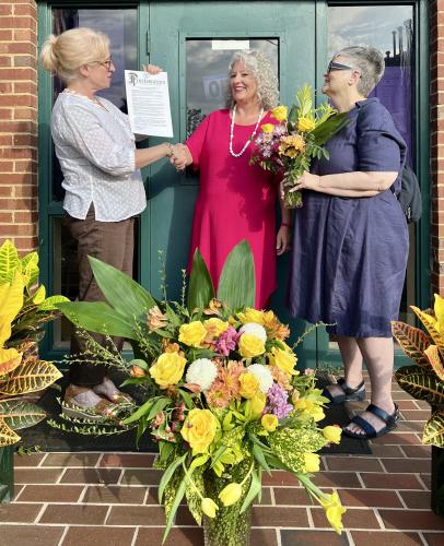 Mayor Evelyn Reece (from left), city clerk Kim Bradford and Jill Severn, mayor pro tem, make the proclamation of Kim Bradford Appreciation Week in Lexington on Monday. The presentation surprised Bradford on her 10th anniversary working for the city. (Submitted Photo)