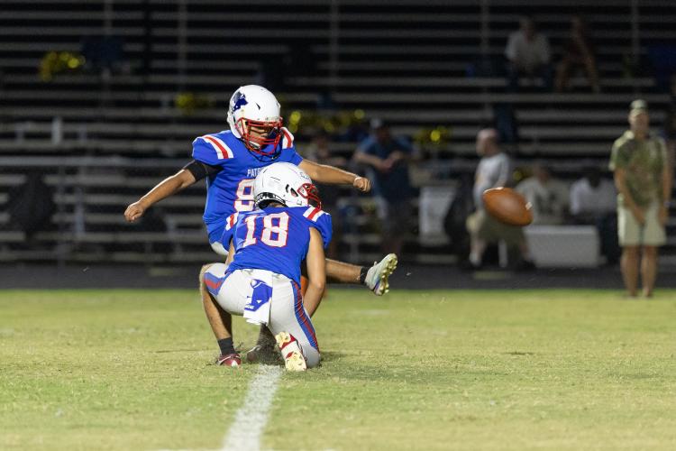 Oglethorpe County’s Omar Sagastume (88), who also plays in the marching band, kicks in the loss to Washington-Wilkes on Sept. 4. Coach Mike Holland asked him to kick for the football team this fall. (Photo/Evan Frilingos)