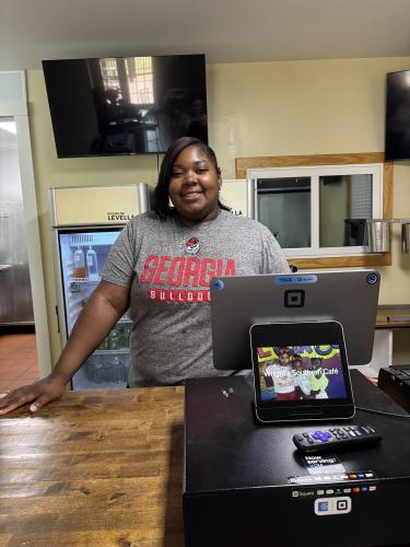 Brittanie Wright stands behind the counter in her restaurant, Wright's Southern Cafe. She is leasing the building from the owners of the previous restaurant, Town and Country Kafe. (Maura Potvin/The Oglethorpe Echo)