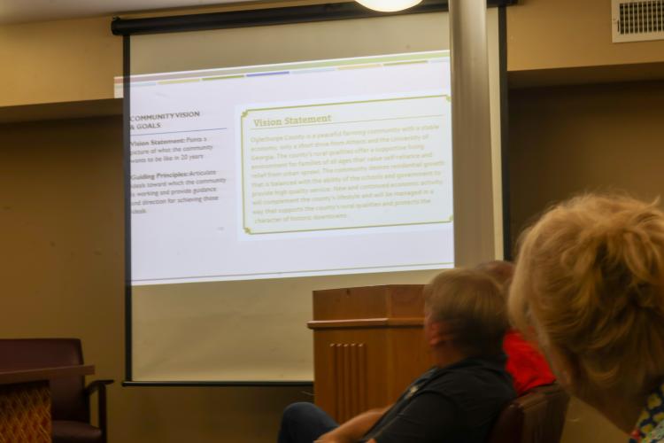 Attendees view a presentation on the Oglethorpe County Comprehensive Plan Update during a public hearing in the Oglethorpe County Commissioners meeting room on Monday. The hearing was the second and final public hearing before the draft plan moved to the regional and state review process. (Photo/Mollie Beth Johnson)