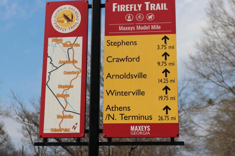 The Firefly Trail sign points North toward the completed section of the trail on Feb. 1, 2026 in Maxeys, Ga. The Restoration Run 5K, which is a part of the Firefly Trail Race Series, benefits the completion of the Firefly Trail. (Photo/Jessie Isaacs)