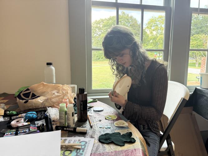 Flannery Ragan works on an embroidery piece at the WCC Creative Cafe on September 3, 2026. Ragan is the creator behind the event. (Sabrina Felix/The Oglethorpe Echo)
