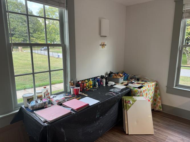 The supply table at the WCC Creative Cafe on September 3, 2026. The cultural center provides free craft supplies for attendees to use at the event. (Sabrina Felix/The Oglethorpe Echo)