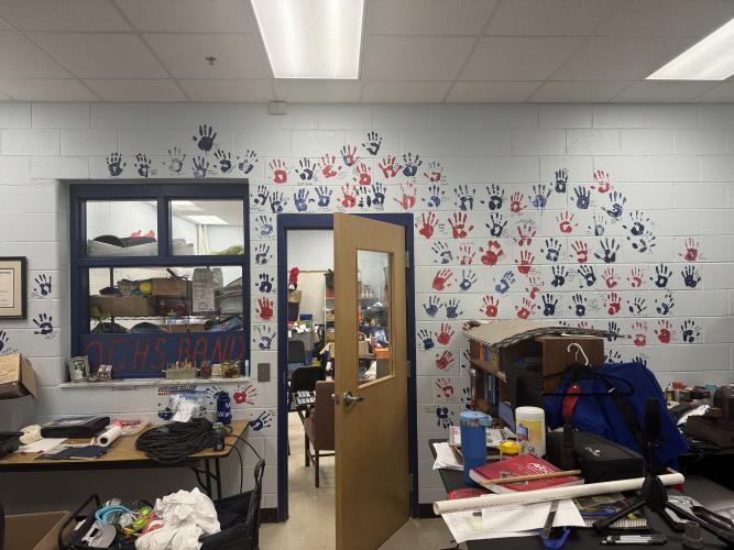 A mural of students' hands on a wall in Lee Jones' office at Oglethorpe County High School on Sept. 14, 2026. Jones has been the band and chorus director at OCHS for 13 years. (Sabrina Felix/The Oglethorpe Echo)