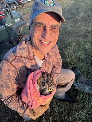 DINK NESMITH/THE OGLETHORPE ECHO Tony DeMarco, who is an Athens ophthalmologist and avid hunter, wraps up the owl he found in a barbed-wire fence on the opening day of dove season on Saturday. He said the owl later died.