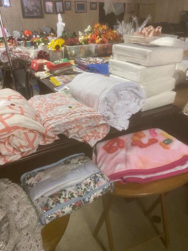 Bedding, linens, seasonal decorations, kitchenware and home decor are among the donated items for sale at the Lexington Community Center. The Downtown Development Authority will use proceeds from the yard sale for heating and air conditioning and other improvements to the building. (Submitted Photo)