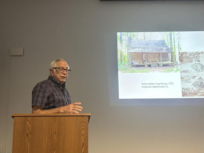 Mark Reinberger answers questions from members of the audience at the Historic Oglethorpe County meeting about his research into historic buildings in Oglethorpe County on Sept. 22 at the Oglethorpe County Library. Reinberger presented research conducted using dendrochronology and other methods.