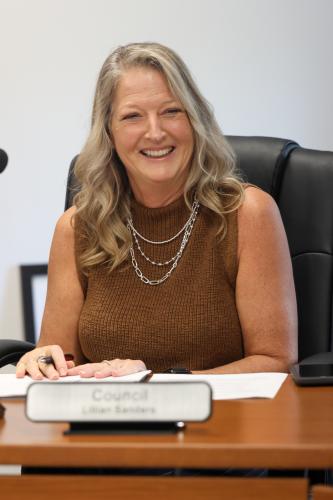 Arnoldsville Mayor Pro Tem Lillian Sanders smiles during a city council meeting on Oct. 15. She served as acting mayor during the meeting.