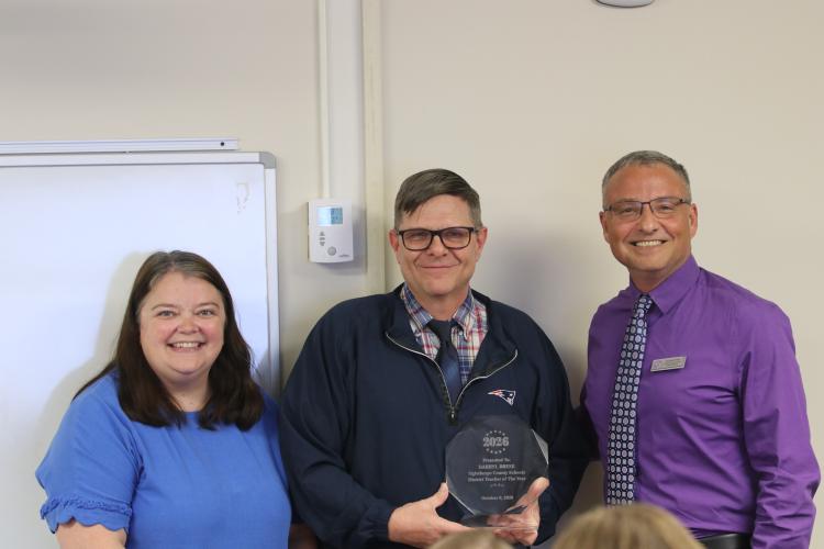 Darryl Brese poses with Superintendent Phillip Powell and Chair of the Board Becky Soto. Brese was awarded Teacher of the District of the Year at the Oct. 8 Board of Education Meeting (Photo/Walker Durham).