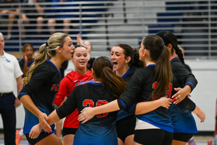 OCHS volleyball players Leanna Newton (from left), Lannah Scarborough, Nora Turner and teammates show their excitement after winning a point against Fannin County on Tuesday. The Patriots advanced to the Class A/AA quarterfinals with a 3-0 victory (Photo/Will Hearn).