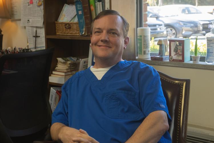 David Moore posing for a portrait on Friday, Oct. 23, at Quiet Oaks Health Care in Crawford, Georgia. Moore has been a CNA for 31 years and is nominated for 2026 CNA of the year for the GHCA Affiliate awards. (SARAH ROPER/THE OGLETHORPE ECHO)