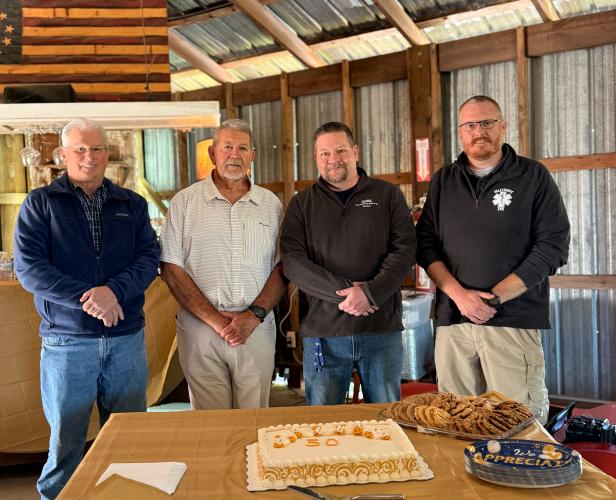 Former EMS directors Brent Sherrer (left), James Mathews, Jason Lewis and Josh Robinson (right) gather to celebrate 50 years of emergency medical services. The former leaders helped shape the organization’s history, growth and dedication to community service over the decades.  (ISABELLA PANG/THE OGLETHORPE ECHO)