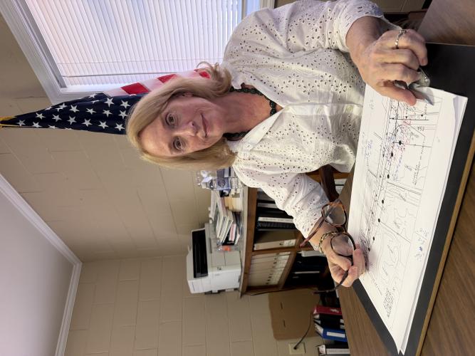 Lexington Mayor Evelyn Reece looks over architecture plans regarding highways running through at City Hall last month. Reece is approaching her first anniversary as mayor after winning the election last November.