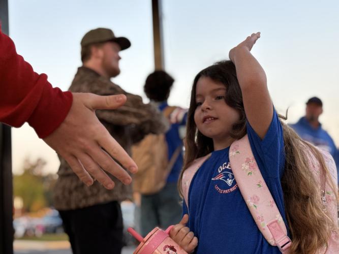 Photos and videos of the Patriot Pride Drop-off are posted on social media each week, and the reaction has been extremely positive. “The parents of the kids that are being posted love it, and they comment back how their kids can’t wait for Friday now, and they look forward to it,” said Campbell. (Photo/Walker Durham)