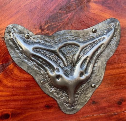 A repoussé metal fox head is attached to a piece of furniture. Both the fox and the furniture piece were commissioned by a client from Patrick Blount, co-owner of Greenhow Handmade Ironworks and the only certified artist blacksmith in Georgia. (Submitted Photo)