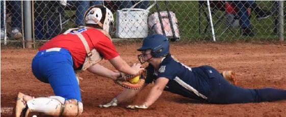 Lady Patriot Catcher Abby Jones blocks the plate and easily tags out a Jefferson County runner last week as Oglethorpe County swept the Lady Warriors 6-1 in both games. The victories gave the local girls their second 4AA region championship in two years. The Lady Patriots split their Tuesday double-header with Toombs County and will finish the best two out of three match-up on Wednesday.