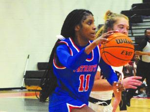Oglethorpe County's Ariana Bell drives to the basked in the Lady Patriots' 67-60 overtime loss Tuesday to Hart County. (Submitted Photo/Ralph Maxwell)