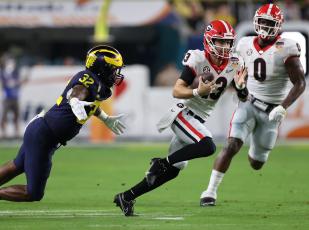Quarterback Stetson Bennett and a tenacious defense led Georgia to an Orange Bowl victory over Michigan and berth in the CFP national title game. (Submitted Photo/ Tony Walsh, UGA Sports)