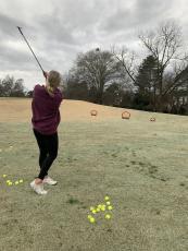 Junior Mackenzie Bowling takes a shot at the University of Georgia golf course. (Meredith Boyd/The Oglethorpe Echo)