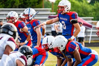 OCHS Jake Turner readies the line as the special teams unit prepares for a punt. The Patriot varsity team played three quarters before the junior varsity players substituted. (Photo/Jack Casey)