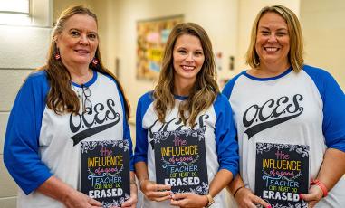 Oglethorpe County Elementary School teachers Jan Kimbrell-Lee, from left, an EIP teacher, Courtney Wheless and Katie Bailey, who both teach fifth grade, show their school pride with matching OCES T-shirts. (Photo/Jack Casey)
