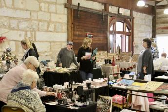 A variety of vendors filled the Crawford Depot during the annual Christmas Mar- ketplace last weekend. Items ranged from hand-poured candles to used books, woven quilts and original photography and paintings. (Lily Baldwin/The Oglethorpe Echo)