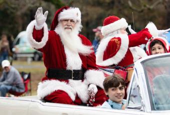 Santa waves from his float in last year’s Maxey's Christmas Parade. This year’s parade, which is scheduled for 11 a.m. Saturday, will feature live music. (Staff/File)