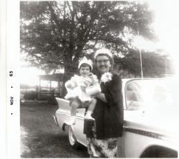 (LINDA HELMLY/PHOTO SUBMISSION) This is Grandma Lee (Parolee Crowe Arnold) (right) and little Linda Helmly (left) in 1963. They are smiling for a photo outside Helmly's childhood home.