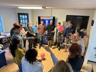 Seven couples engage in an activity about maintaining strong connections in an Elevate class last month. Elevate is an eight-week program focused on reconnecting couples. (Gianna Rodriguez/THE OGLETHORPE ECHO)
