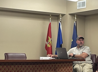 Jeff Sharp, Oglethorpe County’s code compliance officer, listens to the discussion during the Economic Development Authority meeting on Tuesday night. (JULIANNE AKERS/THE OGLETHORPE ECHO)