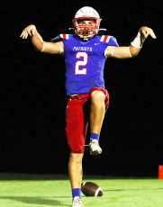 Running back Jake Turner does his best Karate Kid imitation after scoring a touchdown in Oglethorpe County’s 19-7 victory over West Hall in a scrimmage last week. The Patriots open the 2023 season at East Jackson at 7:30 p.m. Friday. (LANDEN TODD/THE OGLETHORPE ECHO)