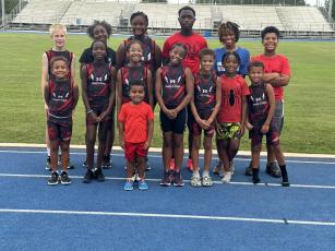 Several junior AAU track athletes pose for a photo (Submitted photo)