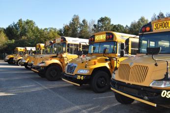 School buses sit outside the Oglethorpe County transportation office on Oct. 22, 2022. (Photo/Megan Fitzgerald)