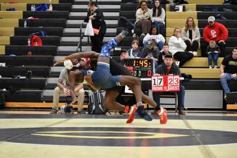 Oglethorpe County’s Paris Crowder, a freshman, takes down his Elbert County opponent during the area team duals on Saturday. The Patriots defeated the Blue Devils to advance to the area final against Commerce. (Wade Cheek/For the Oglethorpe Echo)