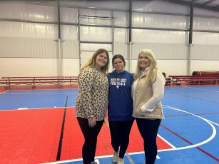  [Photo by Micahya Costen]  Montana Barner (from left), her sister Carolyn Barner and Tina White volunteered at the Great Spring Sport Equipment Swap last Saturday. White said she plans to hold other swaps in various sports seasons. 