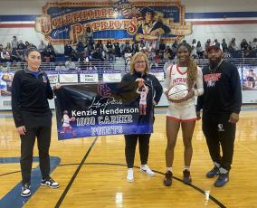 OCHS girls coach Brianna Dickens (from left), assistant coach Cindy Roach, Kenzie Henderson and assistant coach George Gresham commemorate Henderson’s 1,000 career point. (Submitted Photo)