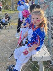Submitted photo Magnolia Haynie, 5, hangs out in the dugout with her teammates  before her game in the coach toss league at Bryan Park. There are  26 Little League teams this spring