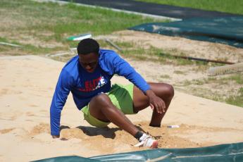 Ke’mauri Brown lands in the sand pit while practicing the long jump two years ago. He qualified for state in the long jump and the 100 meters, and is on both the 4x100 and 4x200 relay teams. (Samuel Higgs/The Oglethorpe Echo)