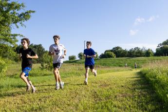 OCHS cross country runners Julian George (from left) John Adams and Payton Duvall run during practice at the new cross country course at Oglethorpe County Middle School on Tuesday. The course was completed in early April. (Ethan Greene/The Oglethorpe Echo)