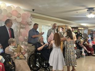 Pageant winner Rachel Lowry receives flowers after being announced as Ms. Quiet Oaks 2026. Family members and friends of the Quiet Oaks community volunteered to help run the event, and Lowry will advance to the state-level pageant in Atlanta in August. (Sarah Nanos/The Oglethorpe Echo)