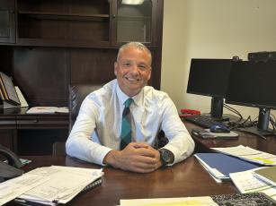 Phillip Powell’s desk at the central office is filled with paperwork as he continues to assimilate to his new position as superintendent of the Oglethorpe County School System. Powell replaced Beverley Levine, who retired. (Andy Johnston/The Oglethorpe Echo)