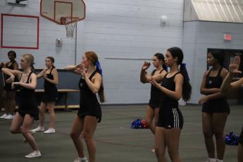 Members of the OCHS cheerleading team practice their routines at the school system’s multipurpose building last week. The team features 12 seniors. (Ellie English/The Oglethorpe Echo)