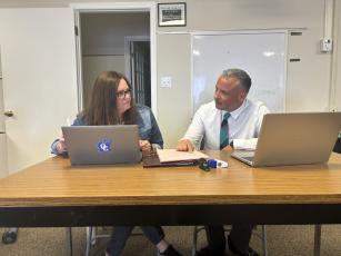 Karyn Gunter (left), the director of special education and student support, confers with Oglethorpe County School Superintendent Phillip Powell during a meeting on July 20. Powell will hold a community feedback time on Saturday. (Andy Johnston/The Oglethorpe Echo)