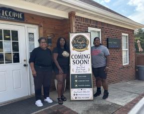 Loretta Jack (left), Tara Huff (middle) and Brittanie Wright stand outside their new restaurant, Wright’s Southern Cafe, which is scheduled to open on Sept. 26. Wright is leasing the building and will run the restaurant with help from her mother and grandmother. (Maura Potvin/The Oglethorpe Echo)