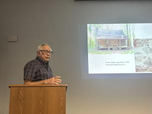 Mark Reinberger answers questions from members of the audience at the Historic Oglethorpe County meeting about his research into historic buildings in Oglethorpe County on Sept. 22 at the Oglethorpe County Library. Reinberger presented research conducted using dendrochronology and other methods.