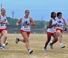 Members of the Oglethorpe County girls cross country team take part in the inaugural Patriot Stars and Stripes Invitational on Saturday at its new course. More than 300 runners took part in the event. (Submitted Photo)