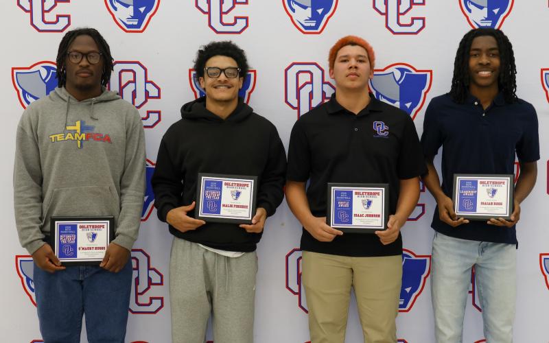 The OCHS boys basketball award winners (from left): O’Maury Huggs (Defensive Player of the Year), Malik Forshee (Offensive Player of the Year), Isaac Johnson (Hustle Award) and Isaiah Ross (Leadership Award). (Addison Simmons/The Oglethorpe Echo)