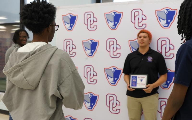 Oglethorpe County High School boys basketball player Isaac Johnson has his photo taken at the OCHS winter sports ceremony on March 5, 2026. (Addison Simmons/The Oglethorpe Echo)
