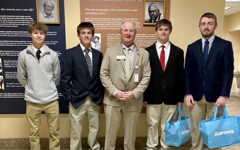 State Rep. John Corbett met OCHS students John Adams (from left), Lincoln Paradise, Jack Baldwin and Jake Huff at the Capitol on Feb. 25. OCMS student Camden Huff made the trip the previous day. (Submitted Photo)
